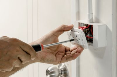 Electrician Repairing Outlet